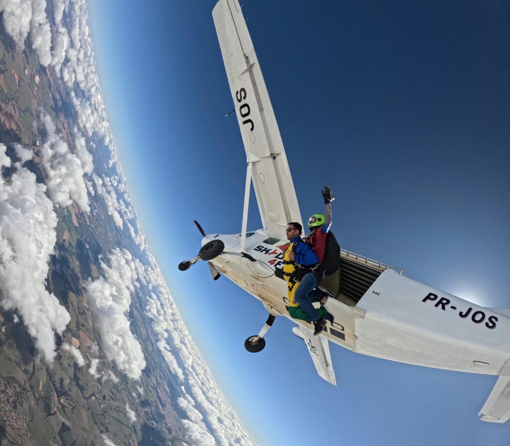 Experience the exhilaration of tandem skydiving from an airplane high above stunning landscapes.